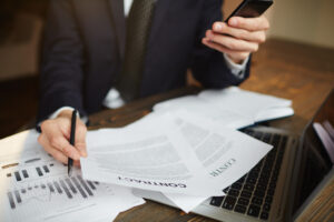 a person doing bookkeeping for law firm documents on the table